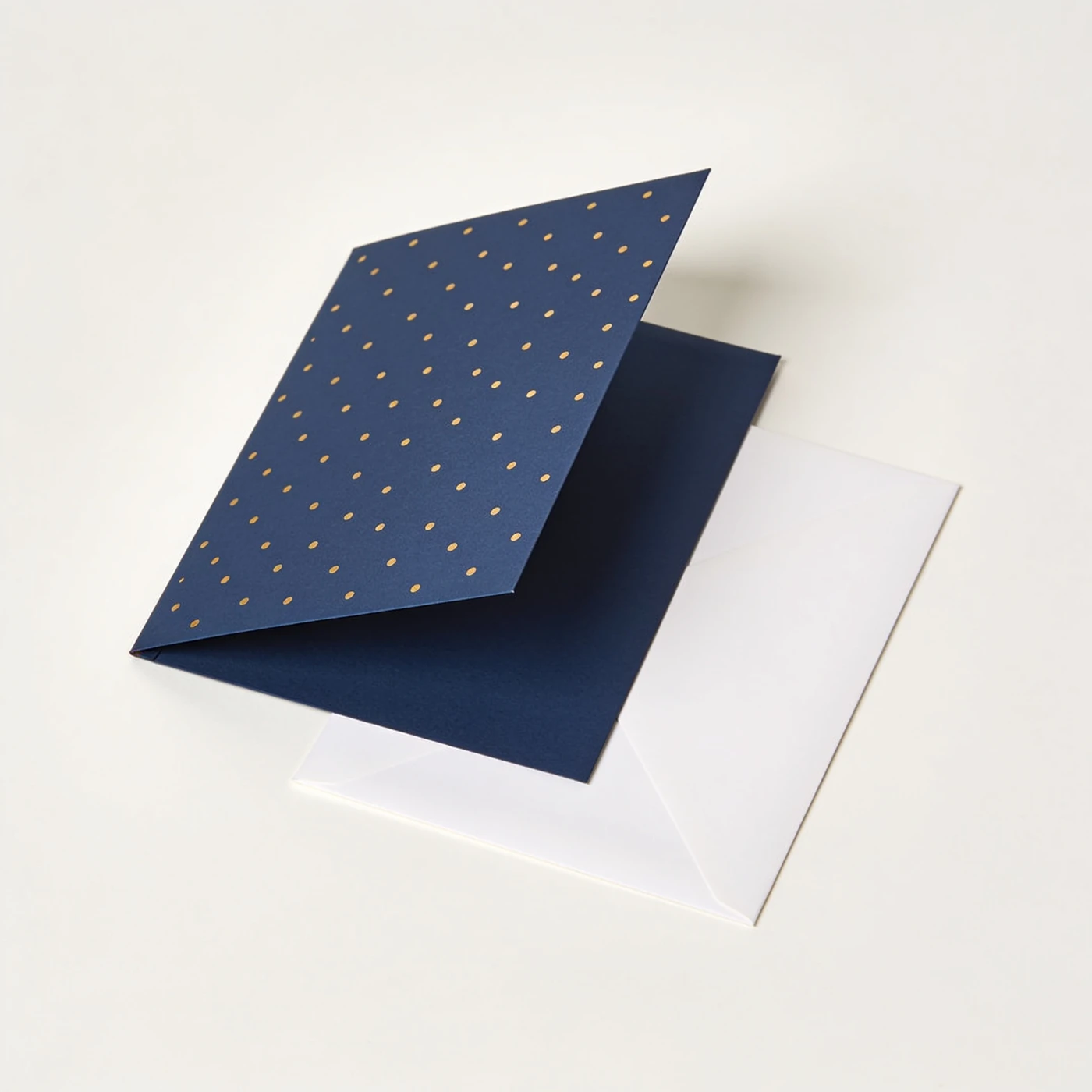 Constellation Foil Card — midnight folded card with nonletter gold-foil dot pattern; white envelope
